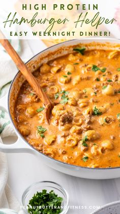 a pot full of hamburger helper soup with a wooden spoon in it and the title overlay reads, high protein hamburger helper easy weight dinner