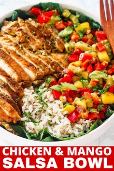 chicken and mango salsa bowl with rice in a white bowl