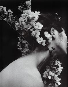 a woman with flowers in her hair