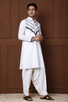 White kurta with thread embroidered floral jaal and geometric patterns. Comes with a pathani. - Aza Fashions Cotton Sherwani With Naqshi For Festivals, Festival Cotton Sherwani With Naqshi, Cotton Salwar Kameez With Naqshi For Navratri, Traditional Naqshi Salwar Kameez For Navratri, Cotton Salwar Kameez With Naqshi For Festivals, Festival Cotton Salwar Kameez With Naqshi, Traditional Lawn Suit With Dabka For Navratri, Traditional Lawn Suit With Naqshi For Navratri, White Straight Kurta Salwar Kameez With Traditional Patterns