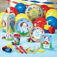 an assortment of children's birthday party supplies including balloons, plates and napkins