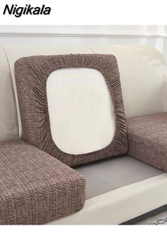 two brown and white couches sitting next to each other