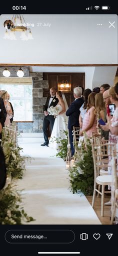 the bride and groom are walking down the aisle