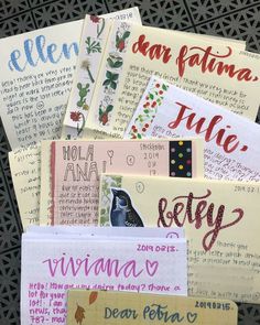 several different types of handwritten greeting cards on a black surface with the words written below them