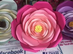 paper flowers are arranged on top of each other