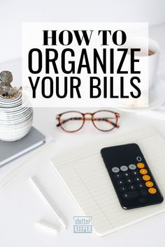 a desk with a calculator, pen and glasses next to it is the title how to organize your bills