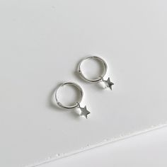 These sterling silver hoops or sleepers have a gorgeous dainty charm that can be easily removed when you want to wear as a basic sleeper. They are minimalist, great for stacking and very comfortable due to their lightness. Perfect for both adults and children and lovely for a gift, too.  As a 12 mm sleeper hoop, they can be a bit tricky for some people to close so we recommend you have someone help close them for you.  💖 Details 925 Sterling Silver Diameter: 12 mm Charm: 6 mm 💕 Online store: www.thejewellerytree.net 💕 Stay up-to-date with new designs & special offers  - FOLLOW ME   Socials: @myjewellerytree OR  https://www.facebook.com/thejewellerytree1/  💕 Need more info, feel free to email - I'd love to help 💕And please visit my store https://www.etsy.com/au/shop/TheJewelleryTreeCo Sterling Silver Star Charm Huggie Earrings, Silver Star-shaped Minimalist Huggie Earrings, Silver Star Huggie Earrings For Everyday, Silver Star Huggie Earrings Minimalist Style, Minimalist Star-shaped Sterling Silver Huggie Earrings, Sterling Silver Star Huggie Earrings Minimalist Style, Minimalist Silver Star Huggie Earrings, Minimalist Sterling Silver Star Huggie Earrings, Sterling Silver Star Shaped Minimalist Huggie Earrings