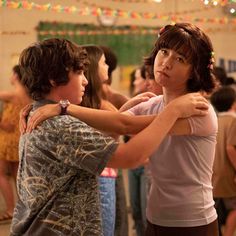 two children are dancing together in a dance class