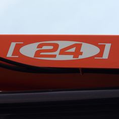 an orange sign with the number 124 on it