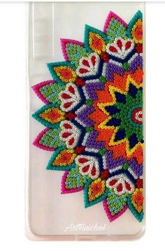 an iphone case with beaded designs on it