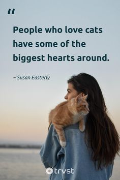 a woman holding a cat in her arms with the quote people who love cats have some of the biggest hearts around