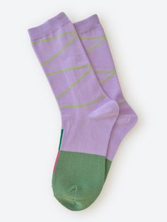 The Hyde crew socks feature a base of lavender accented with light green lines and a darker green half foot. Topside color bars give you a secret wink in red and green. Inspired by design, art, travel, and positivity, Hooray Sock Co. socks are bold graphic statements of enthusiasm and style. Hooray Sock is a local (to us!) company. The husband-and-wife founders met while studying for their MFAs in design at California College of the Arts. They launched Hooray Sock Co. in 2017 to bring a little j California College, Large Man, Art Travel, Crew Socks, Light Green, Dark Green, Sale Items, Design Art, Lavender