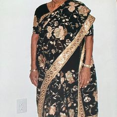 Black Saree With Gold Flower Work Throughout The Saree With Gold Border And Palav. This Saree Was Never Worn! Formal Black Embroidered Saree, Black Blouse Piece With Floral Embroidery For Wedding, Black Lehenga With Floral Embroidery, Black Blouse Piece With Sheer Dupatta For Celebration, Celebration Black Blouse With Sheer Dupatta, Black Saree With Floral Embroidery In Traditional Drape, Traditional Black Saree With Floral Embroidery, Black Bollywood Saree With Floral Embroidery, Black Fitted Pre-draped Saree For Celebrations