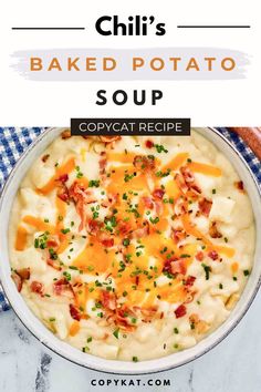 a bowl filled with baked potato soup on top of a blue and white checkered table cloth