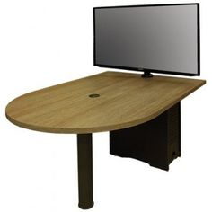 a computer desk with a flat screen on it's top and an open drawer underneath