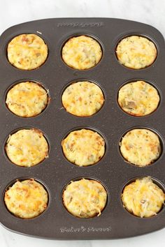 muffins in a pan with cheese and meat toppings on top, ready to go into the oven