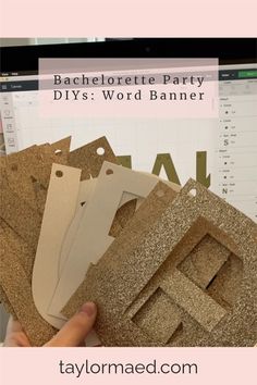 someone is holding up some cardboard letters to make it look like they have been made out of