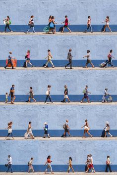 many people are walking down the street together