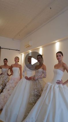 a group of women standing next to each other wearing dresses with sequins on them