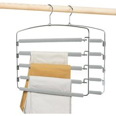 an over - the - door drying rack holds four towels and two folded napkins