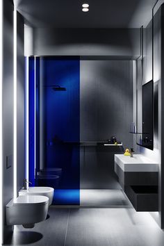 a modern bathroom with blue and grey walls