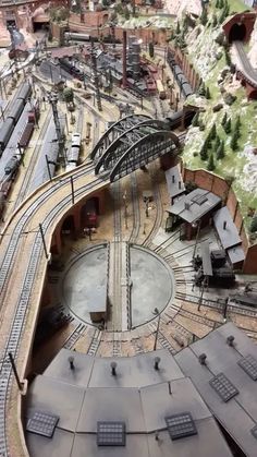 an aerial view of a model train station