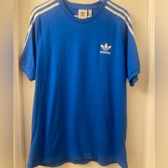 Brand New Never Worn Still Has Tag Casual Fitted T-shirt With Three Stripes, Fitted Casual T-shirt With Three Stripes, Casual Fitted T-shirt With Three Stripes Branding, Blue Three Stripes Tops For Summer, Blue Cotton T-shirt With Three Stripes, Fitted Crew Neck T-shirt With Three Stripes, Fitted Three Stripes Crew Neck T-shirt, Adidas Blue Long Sleeve Tops, Blue Adidas Long Sleeve Tops