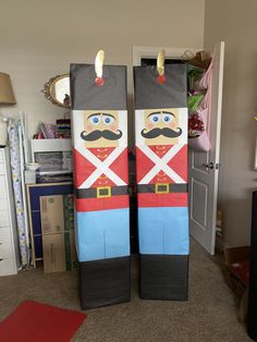 two cardboard nutcrackers are standing in the middle of a room with carpet