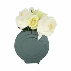 white roses in a gray vase on a white background