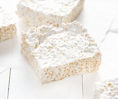 several pieces of rice krispy treats on a white surface