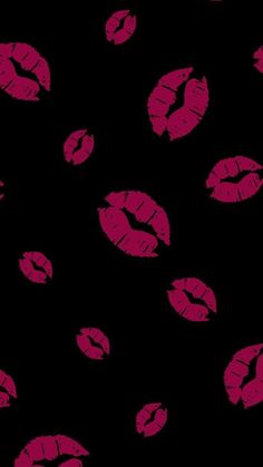 red lipstick kisses on a black background seamless wallpaper or fabric design for clothing and home decor