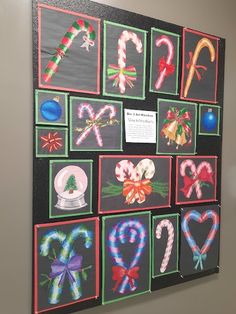 a bulletin board with candy canes and christmas decorations on it's blackboard