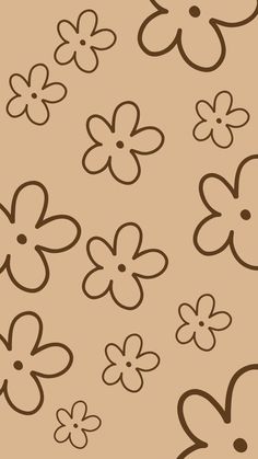 a bunch of flowers that are on a brown background