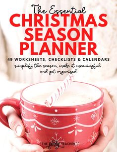 the essential christmas season planner is shown in red and white, with a candy cane sticking out of it