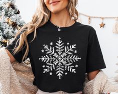 Snowflake Winter Christmas T-Shirt, Christmas Snowflake Shirt, Snowflake Christmas Tee, Women Christmas Shirt,Winter Shirts,Snowflake Shirt  DESCRIPTION: Elevate your fashion game with our exclusive products. This eye-catching piece seamlessly blends unique design with modern comfort, making it a must-have addition to your wardrobe. Our products offer a soft touch against your skin, providing breathability that ensures you stay comfortable throughout the day. Remember, it's not just clothing; it's an expression of your personality. Embrace the quality, embrace the style. Order now and experience the difference! If you have any questions or need assistance, please don't hesitate to contact us. We're here to help you. Why Choose Our Product? Attention to Detail: Our team takes pride in handc Snowflake Shirts Vinyl, Winter Sweater Snowflake, Snowflake Shirt, Winter Holiday Long Sleeve T-shirt, Snowflake Sweatshirt, Winter Shirts, Music Event, Christmas Tees, Christmas Women