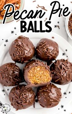 chocolate covered pecan pie balls are on a white plate and surrounded by candies