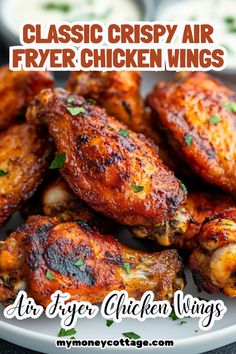 chicken wings on a white plate with the words classic crispy air fryer chicken wings