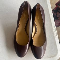 Round Toe, 2 Inch Heel. Brown. Size 8. Never Used. Coach Heels Coach Heels With 4-inch Heel For Formal Occasions, Coach Closed Toe Heels For Office, Coach High Heels For Workwear, Coach Brown Heels With Branded Insole, Coach Heels With Almond Toe, Classic Coach Closed Toe Heels, Coach Wedge Heels For Formal Occasions, Classic Coach Closed-toe Heels, Coach Brown Pointed Toe Heels