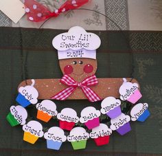 a gingerbread man made out of paper with name tags attached to it and the words our all sweetests 2011