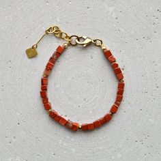 Simple unisex gemstone bracelet with Red Jasper cubes or a natural stone of your choice (see drop-down menu). The design is deliberately kept simple and makes a wonderful gift for a best friend. The gemstones are natural products. Each stone and each pearl is slightly different, which gives this piece of jewelry its special charm. LENGTH The total length is approximately 20 cm and, thanks to the extension chain, fits best on wrists between 16-18 cm in circumference. If you need a different lengt Minimalist Natural Stone Beaded Bracelets For Everyday, Modern Gemstone Beaded Bracelets For Gift, Modern Adjustable Beaded Bracelets With Natural Stones, Modern Gemstone Beaded Bracelets As Gift, Modern Gemstone Beads Bracelet For Gift, Modern Beaded Bracelets With Natural Stones, Modern Beaded Bracelets With Natural Stones For Gift, Red Minimalist Beaded Bracelets For Everyday, Minimalist Red Beaded Bracelets For Everyday