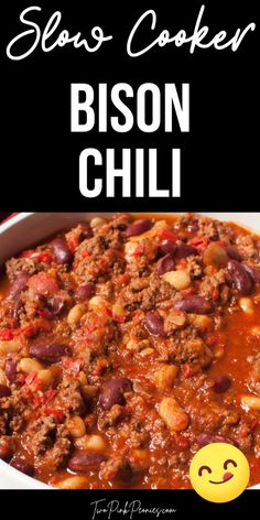 a white bowl filled with chili and beans next to a black background that says slow cooker bison chili