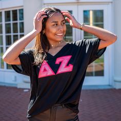 This trendy & unique Pink Marble Sunset Greek Letter Bella Canvas Slouchy V-Neck T-Shirt is sure to stand out on any campus! Grab one for you, your big/little, or a group of sisters Picture Details ⭑ #1-2: Black shirt, Neon Pink background Care Instructions ⭑ Wash inside out on cold & air dry for best results ⭑ Do not dry clean ⭑ Light iron if necessary ⭑ Care instructions are included with every order. We are not responsible for damages if not cared for properly. T-Shirt Info ⭑ Bella + Canvas S Summer School Spirit Tops, College Spirit Tops For Spring, School Spirit Tops For College Spring Season, Stretch Tops With School Spirit For Summer, Casual V-neck Top For College, Casual Black Top For Campus, Black Summer Tops With School Spirit, Black Summer Tops With School Spirit Style, Relaxed Fit Black Top For Campus