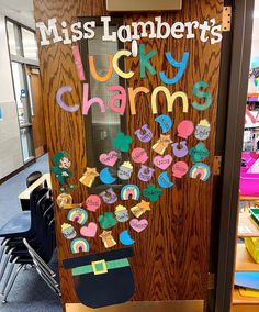 a classroom door decorated with lots of stickers and writing that says, miss lombrert's lucky charms