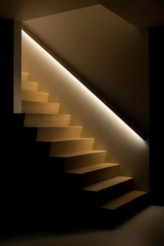 the stairs are lit up and there is only one light in the room to illuminate them