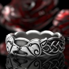 All our wolf rings: https://www.etsy.com/shop/CelticEternity?search_query=wolf This is a Celtic wolf wedding ring that melds the ancient with the modern. It features the head of two wolves intertwined with Celtic knotwork. From wikipedia: The wolf is a common motif in the foundational mythologies and cosmologies of peoples throughout Eurasia and North America (corresponding to the historical extent of the habitat of the gray wolf). The wolf holds great importance in the cultures and religions of Wolf Rings, Wolf Wedding, Norse Wolf, Celtic Wolf, Two Wolves, Wolf Ring, Gray Wolf, Wolf Jewelry, Celtic Knot Ring