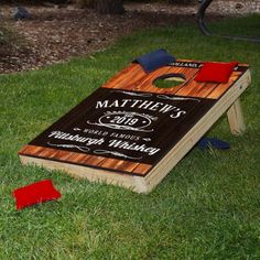 a cornhole game set up in the grass