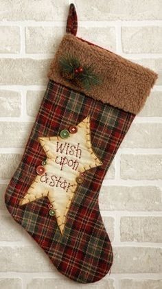 a christmas stocking hanging on a brick wall with the words wish upon astar