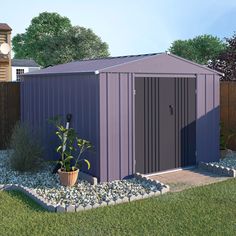 a purple shed sitting on top of a lush green field