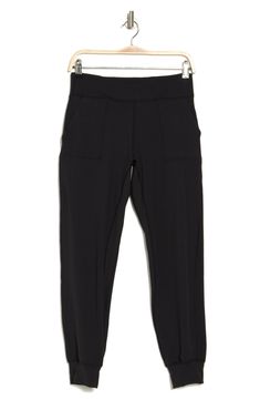 Enjoy a morning stroll in these comfy stretch-knit joggers that inspire you to get moving. 12'' rise, 27'' inseam (size M) Elastic/drawstring waist 2 slant pockets 78% polyester, 22% spandex Machine wash Imported Model stats: 5'10" height, 32" bust, 25" waist, 36" hip. Model is wearing size M. Athleisure Ankle-length Yoga Pants With Pockets, 4-way Stretch Joggers With Pockets For Loungewear, Joggers With Pockets For Loungewear, Athleisure Activewear With Pockets And Ankle-length, Sporty Moisture-wicking Bottoms For Everyday, Stretch Joggers With Side Pockets And Ankle-length, Stretch Ankle-length Joggers With Side Pockets, Comfort Stretch Ankle-length Yoga Pants, Everyday Black Activewear With Side Pockets