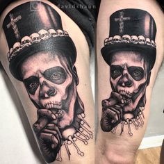 two skulls with hats and crosses on their legs